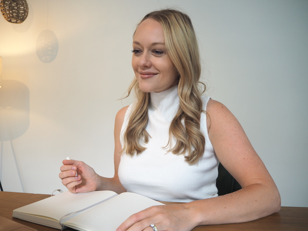 Is Therapy Worth it? Relational Therapist taking notes and looking at laptop